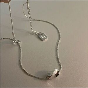 The Inverted Bean charm necklace in 925 silver.